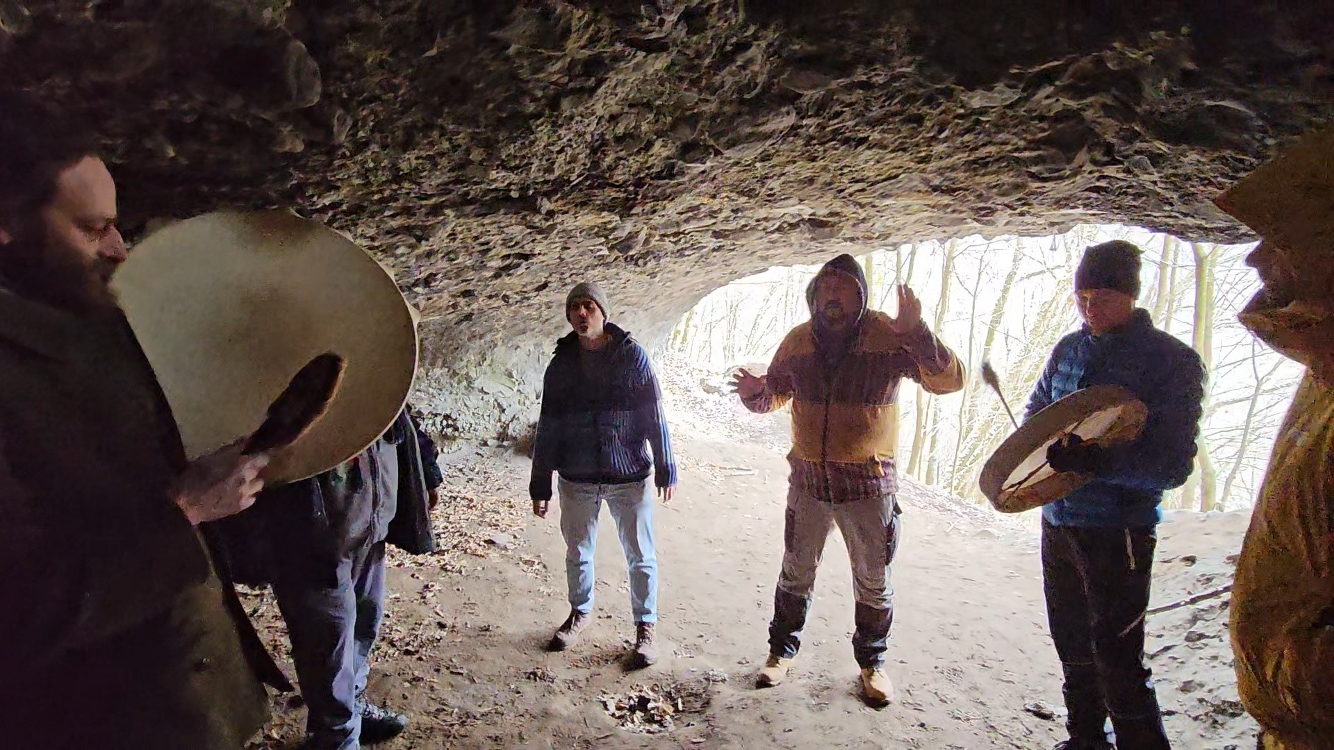 A group of men walking on fire during a shamanic ritual in the mountains